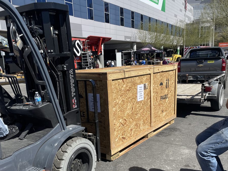Crate staged on forklift outside the shop