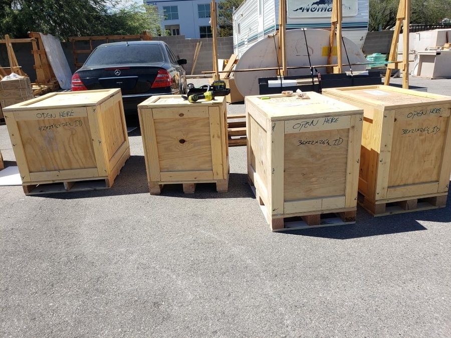 Multiple custom crates staged in the yard